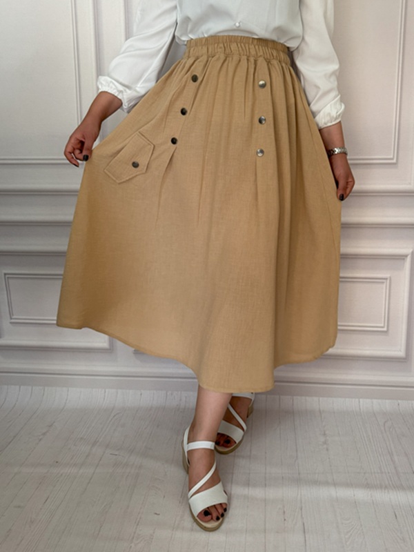 نمای جلوی دامن بابوس زنانه کرم – تن‌خور راحت و شیک با طرح جیب