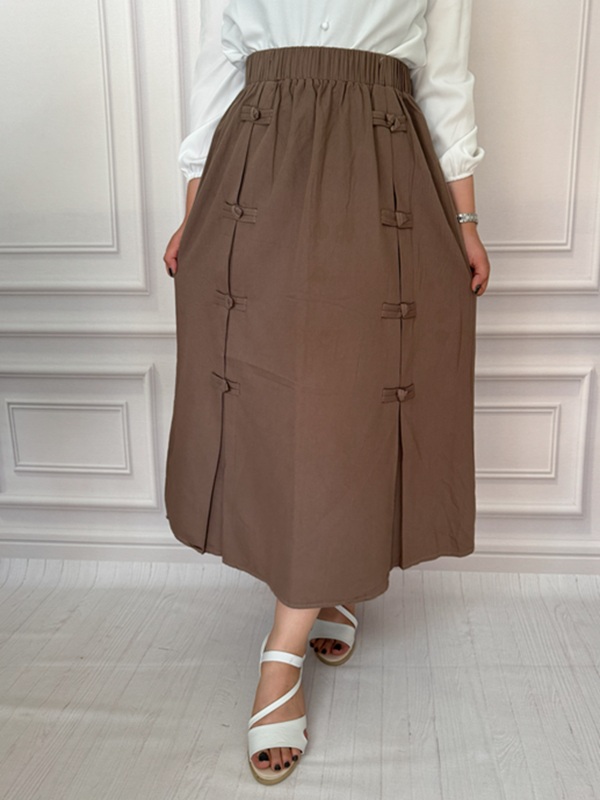 نمای جلو دامن کتان کرم با طراحی ساده و کمر کشی